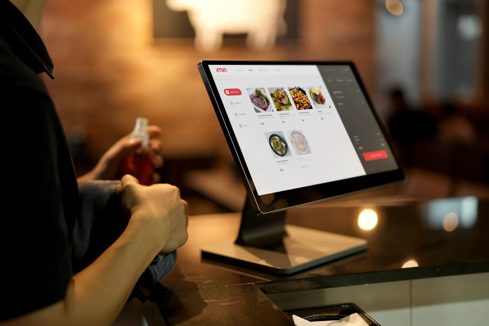 Traveler using a digital ordering screen while checking allergen information