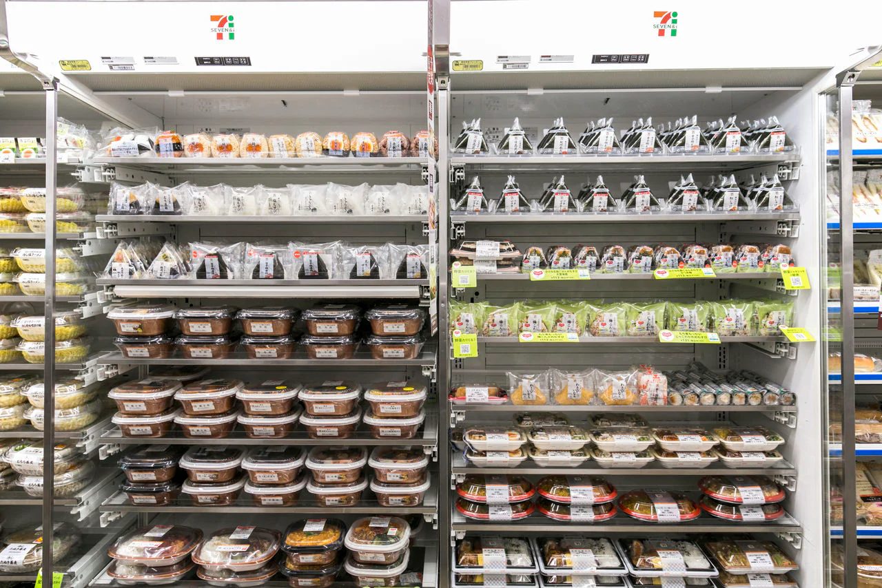 Shelves of packaged food inside a Japanese convenience store