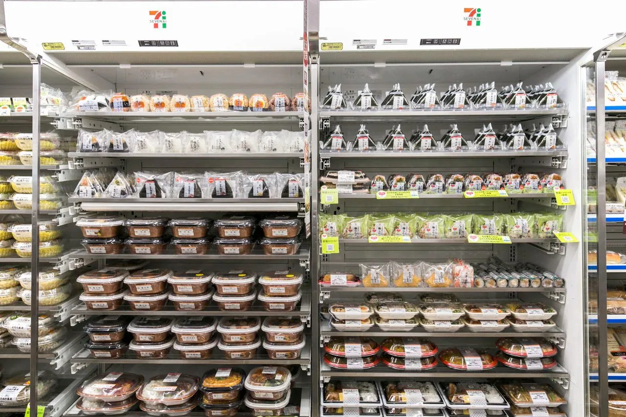 Shelves of packaged food inside a Japanese convenience store