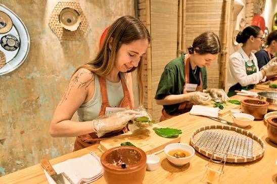 Vietnamese cooking class with fresh herbs, lemongrass, and rice paper