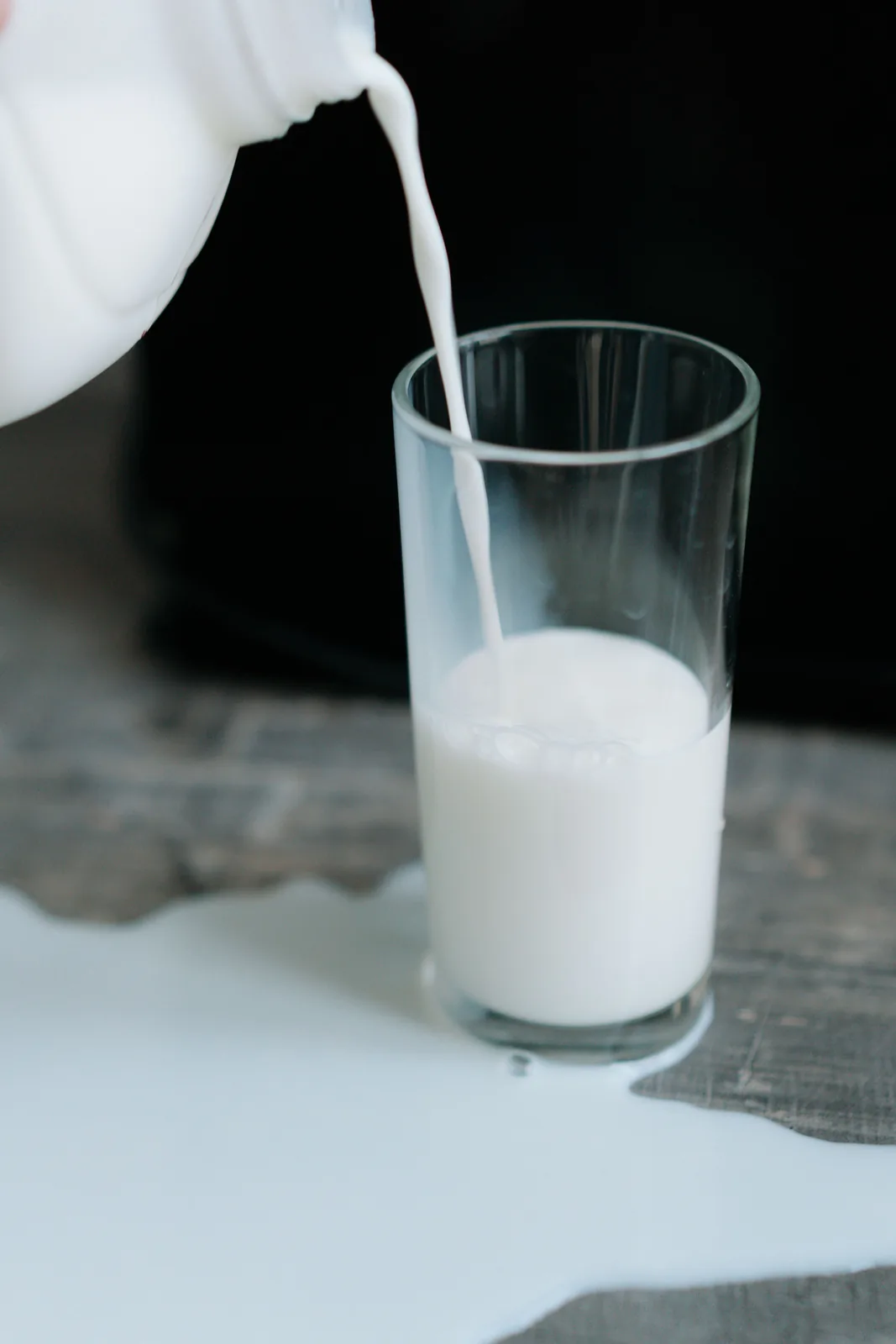 Milk being poured into a glass, close-up