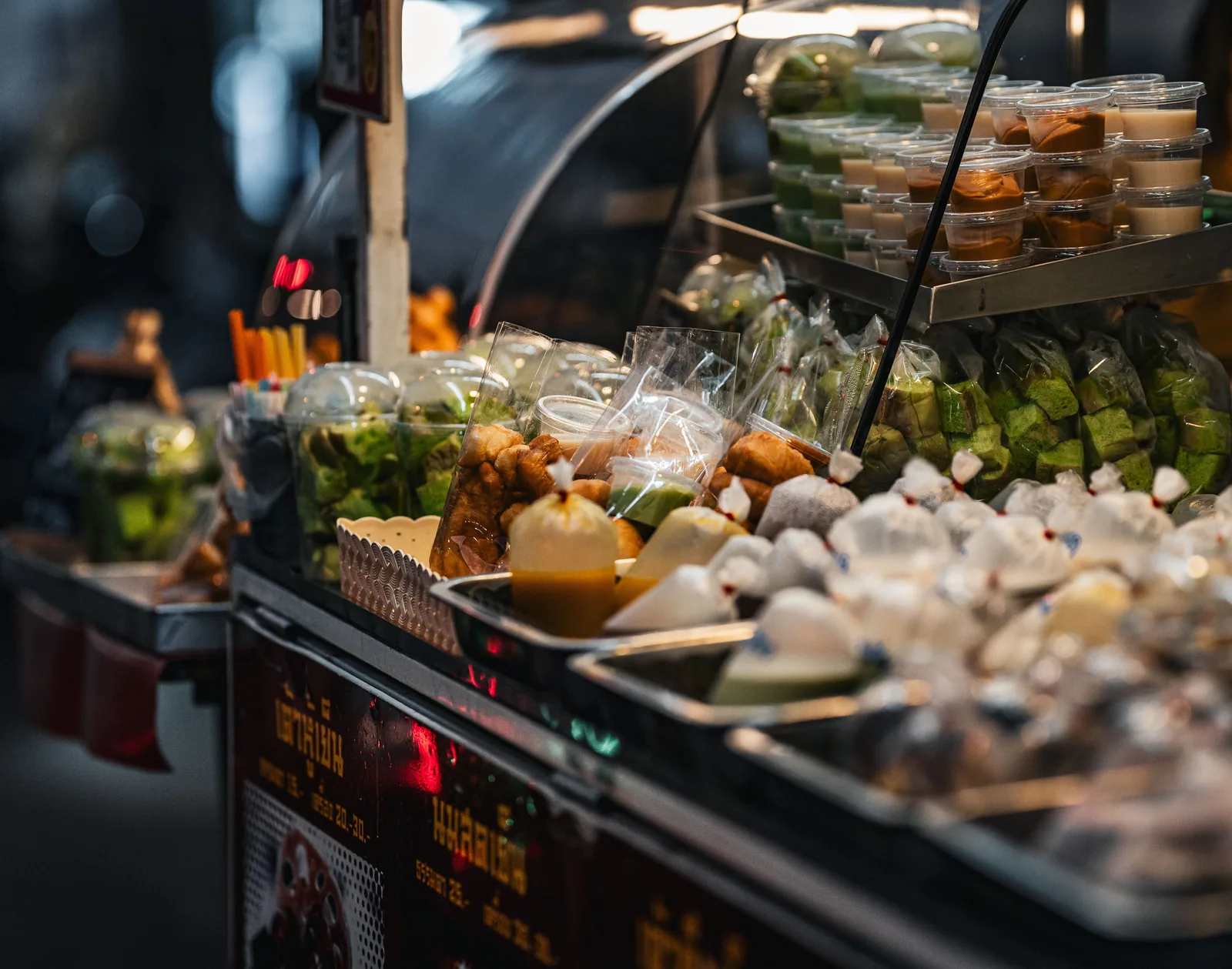 Asian market stall with fruit signage