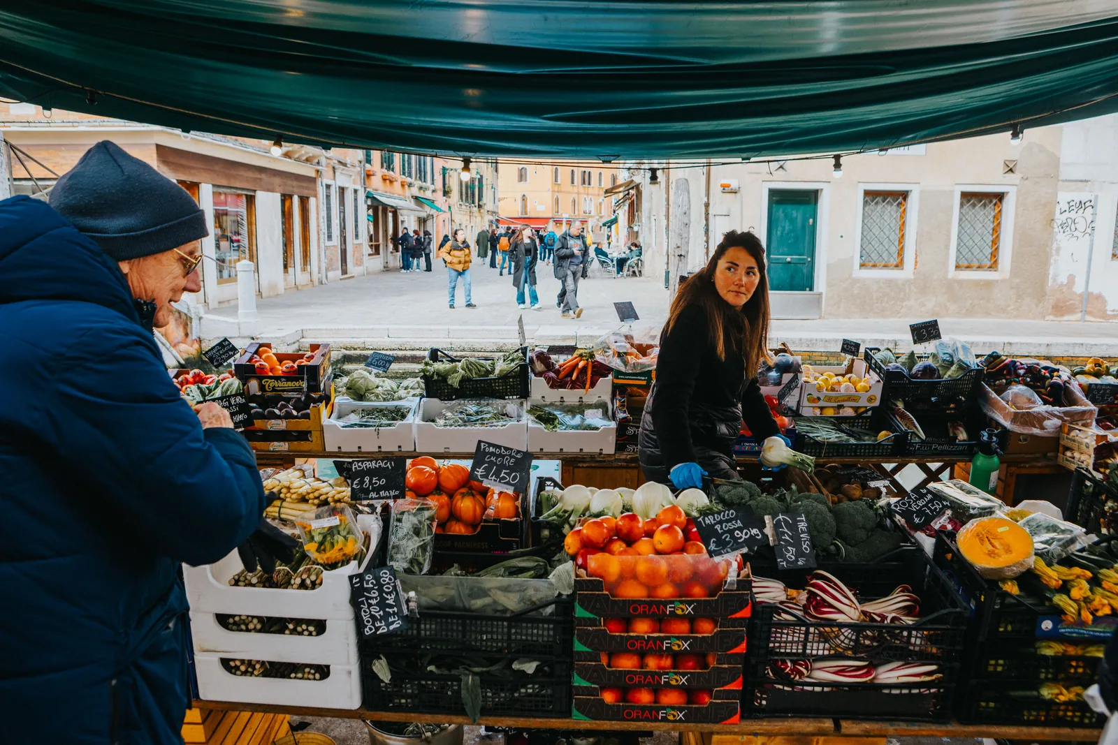 Outdoor produce market stall with fresh fruit and vegetables
