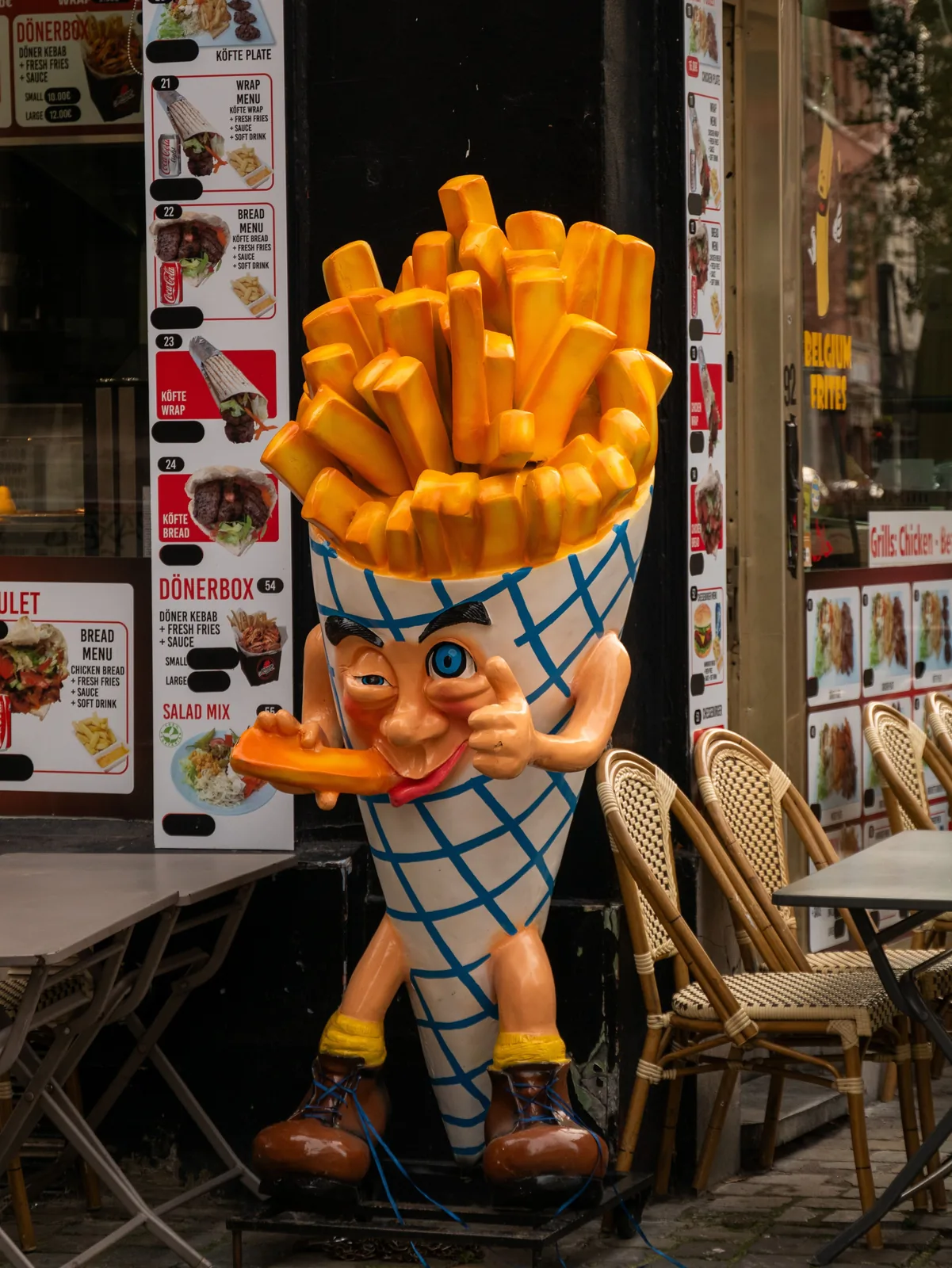 Giant fries statue at a street vendor sign