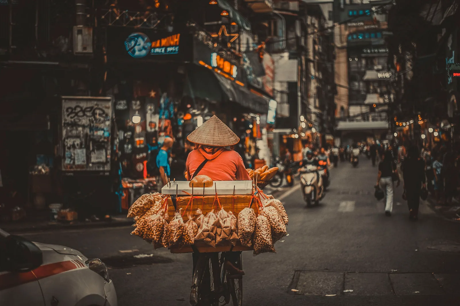Vendor with a bike cart at a night street market