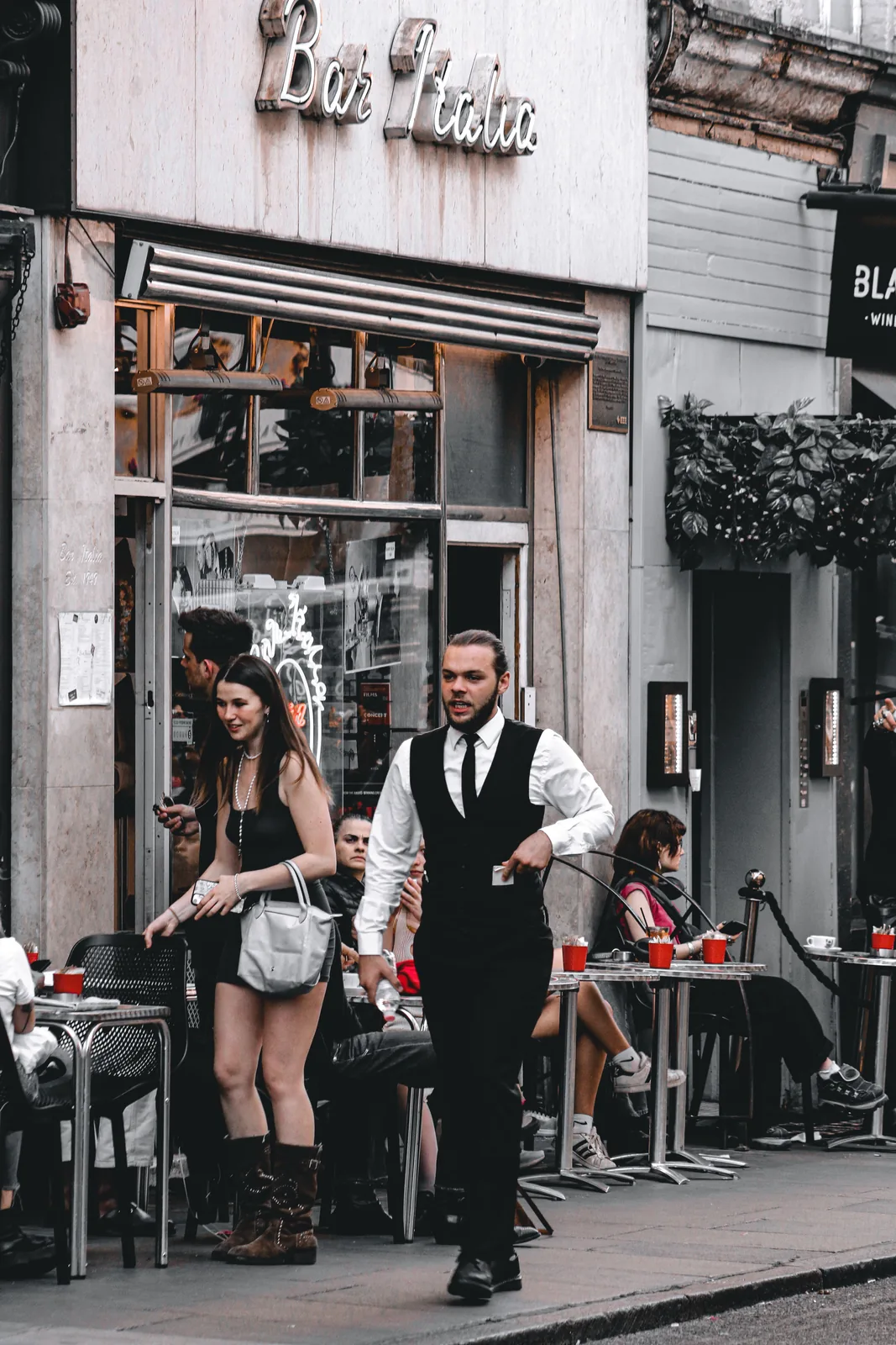 Travelers walking down a European street